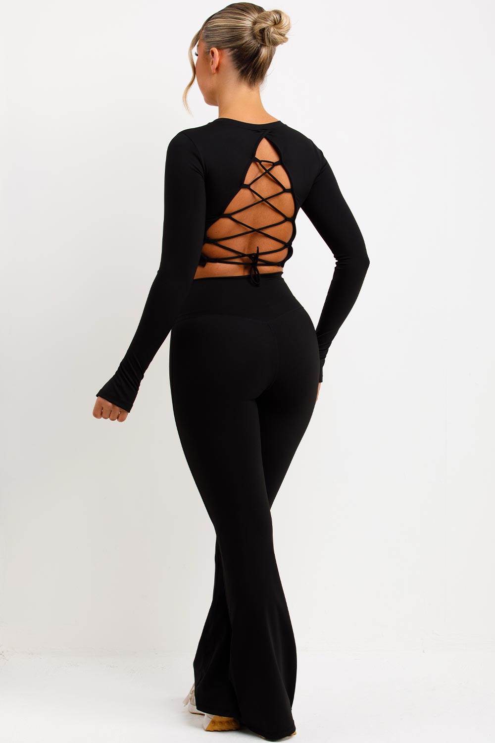 flare trousers with scrunch bum and backless sports crop top set black styledup