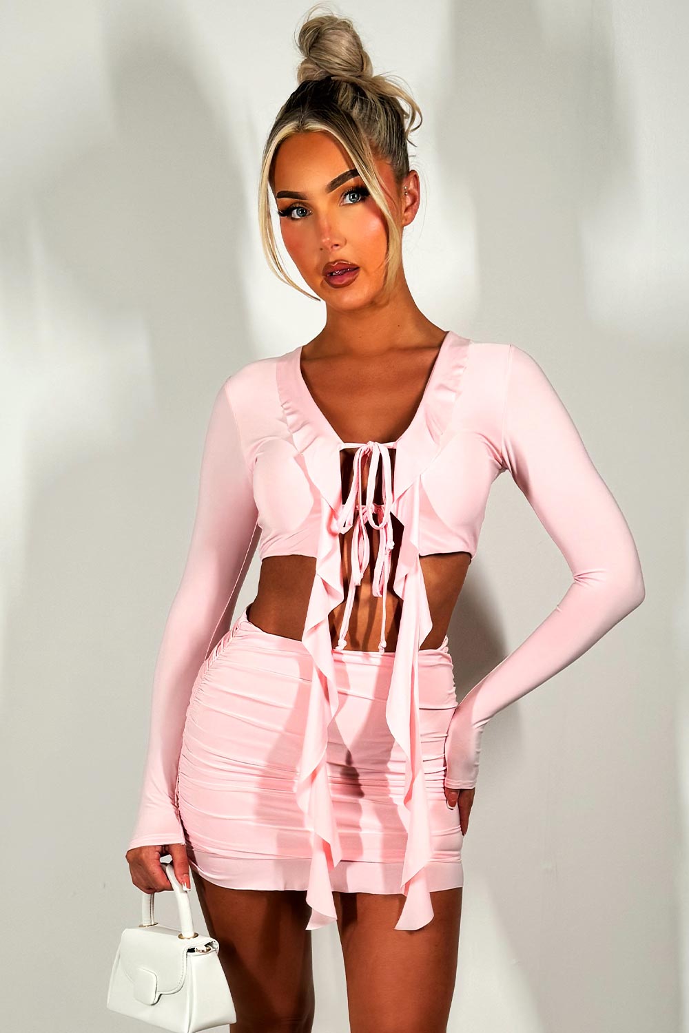 baby pink frill hem mini skirt and long sleeve tie front crop top two piece co ord set festival going out holiday outfit