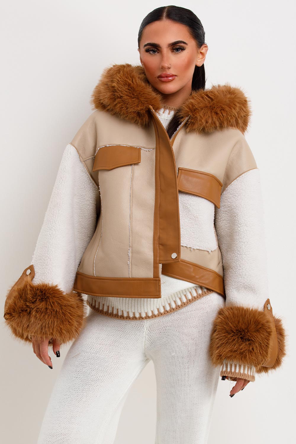 womens faux leather jacket with faux fur hood and shearling detail