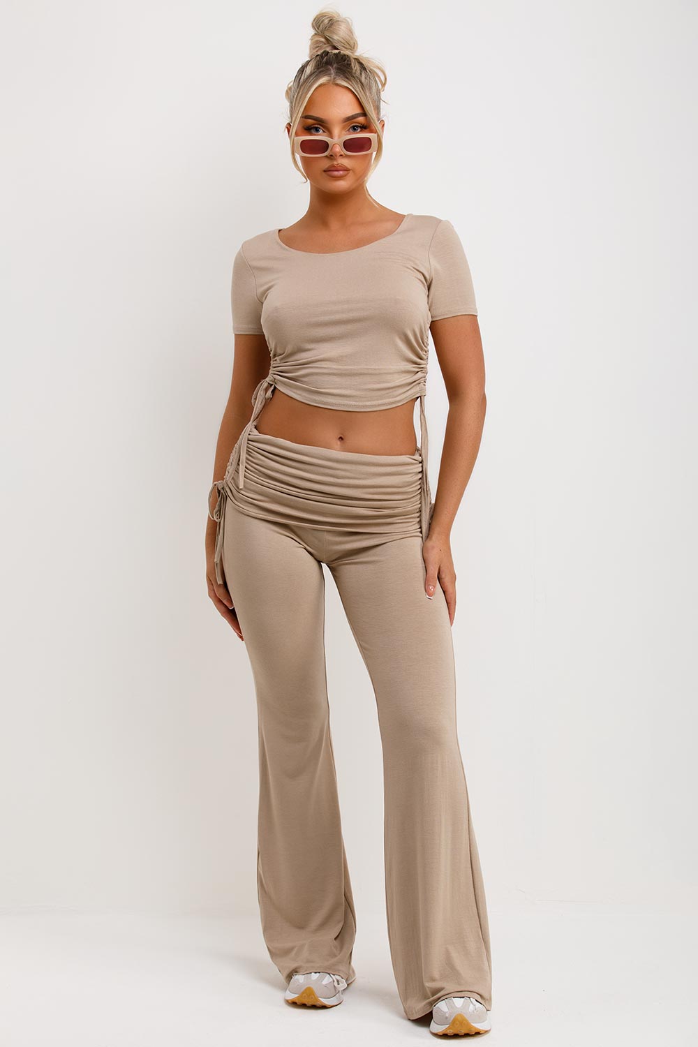beige ruched side fold over flare trousers and crop top co ord set