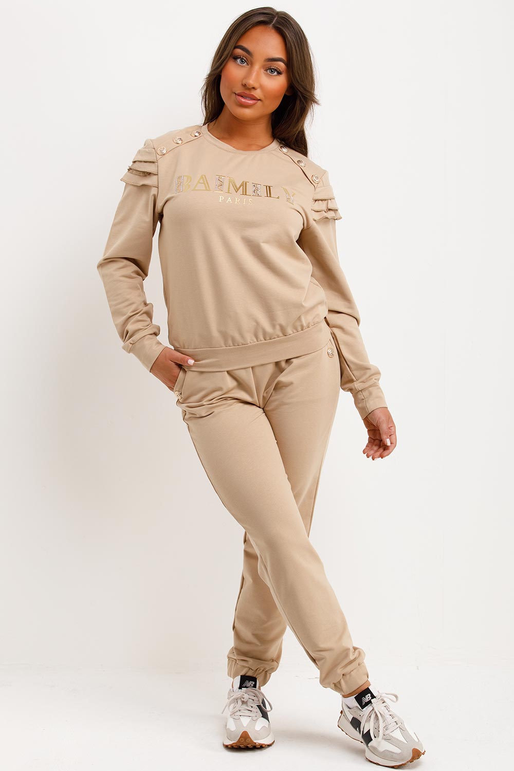 womens tracksuit with gold button and ruffle frill shoulders baimily paris slogan