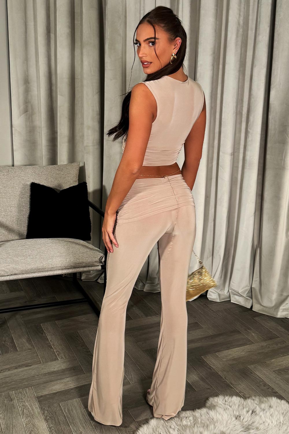 flared fold over trousers and ruched sleeveless top two piece outfit