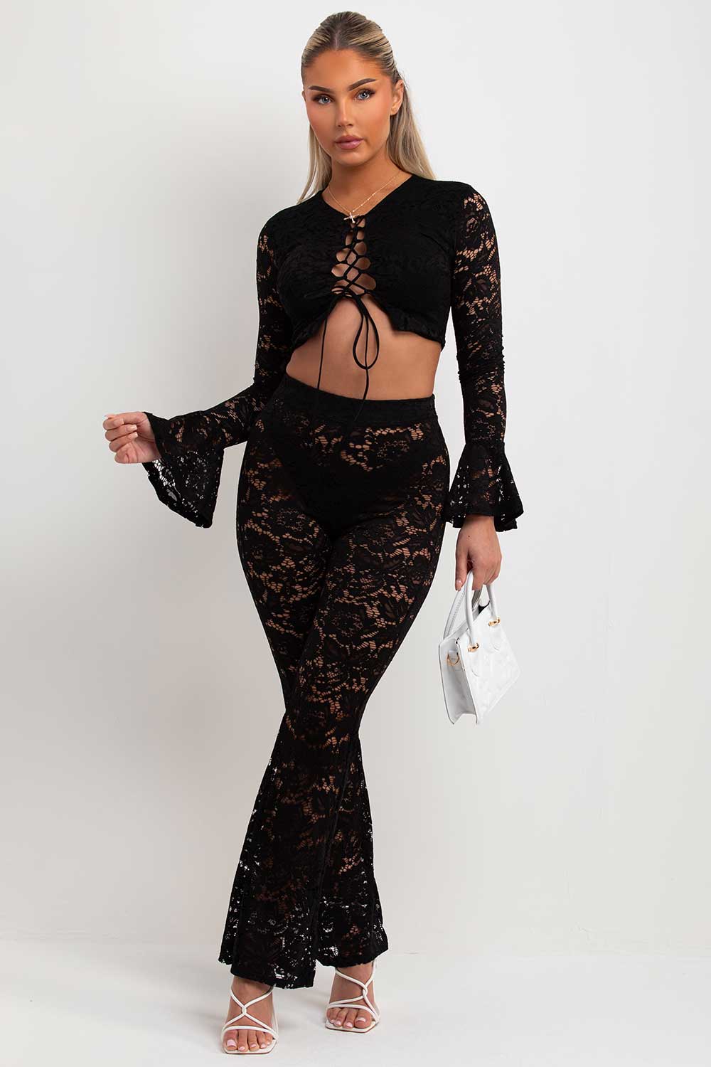 lace flare trousers and long flare sleeve lace up front crop top going out summer holiday festival outfit