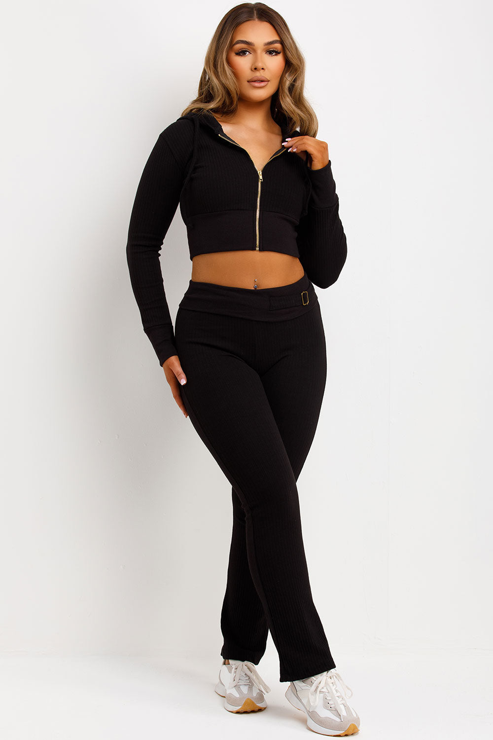 womens zip up crop hoodie and fold over waist buckle detail skinny flare trousers co ord set airport outfit