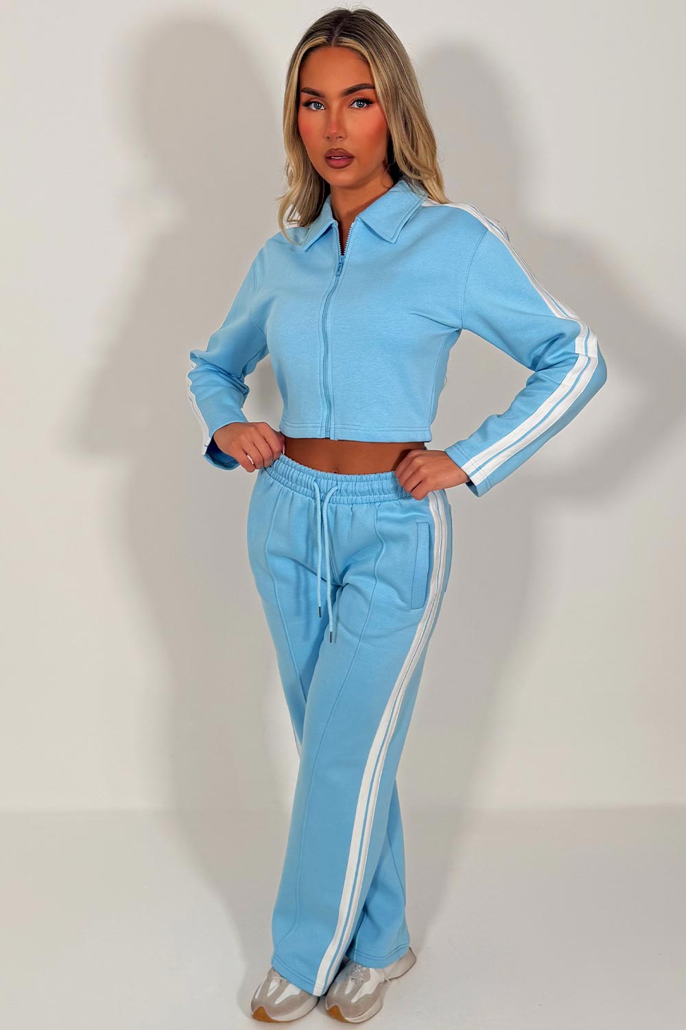 womens sky blue crop sweatshirt and wide leg joggers tracksuit with side stripes airport outfit casual everyday outfit styledup uk white fox