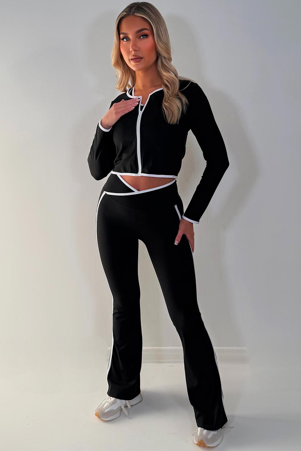 zip up sports jacket crop top and scrunch bum flare pants three piece set black