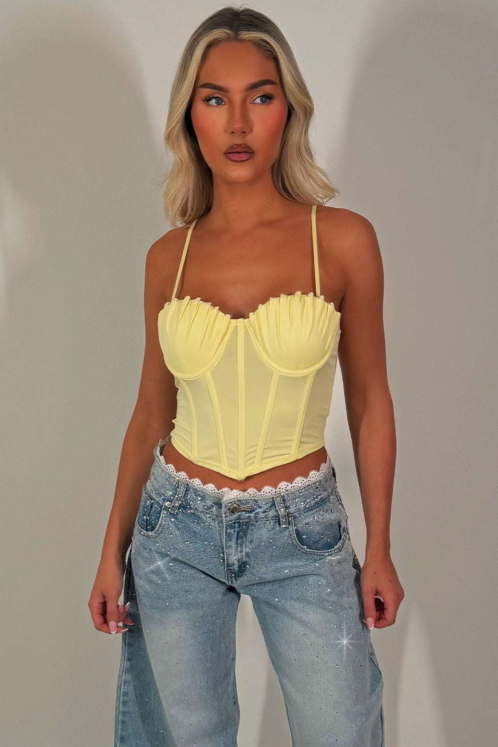 yellow bustier corset top with straps going out festival night out outfit styledup