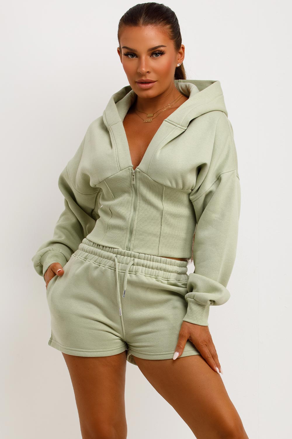 cinched waist crop corset hoodie and shorts tracksuit airport outfit co ord