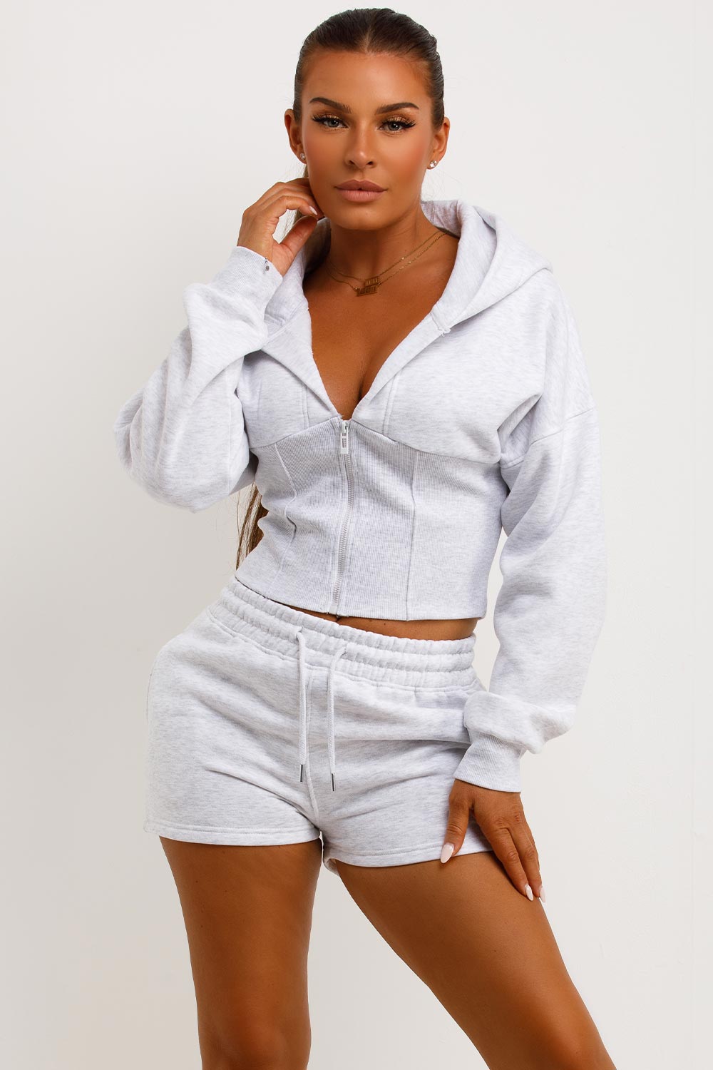 cinched waist crop corset hoodie and shorts tracksuit airport outfit co ord