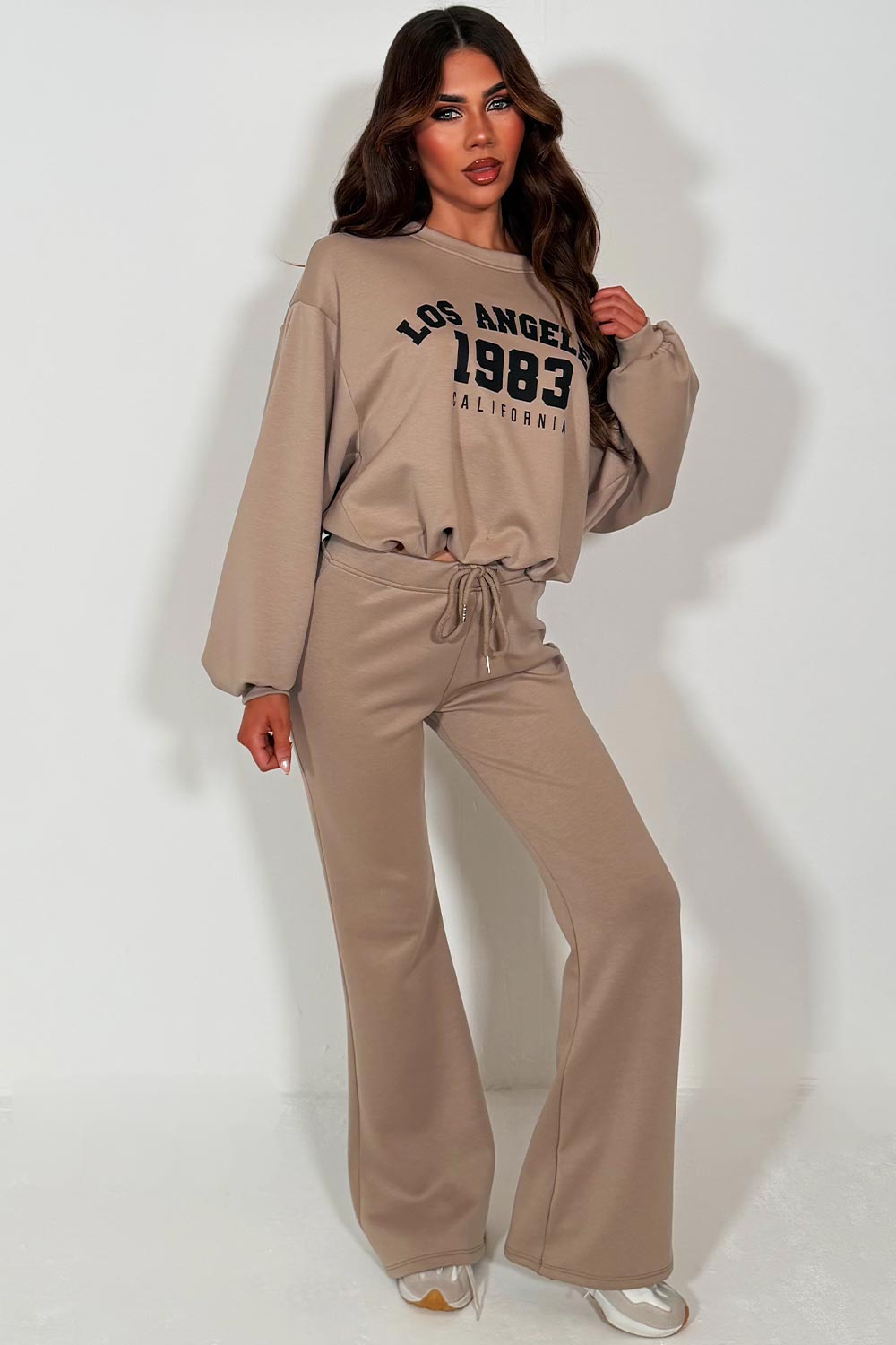 womens oversized crop sweatshirt and bell bottom flare trouser two piece loungewear co ord set beige with los angeles california slogan styledup