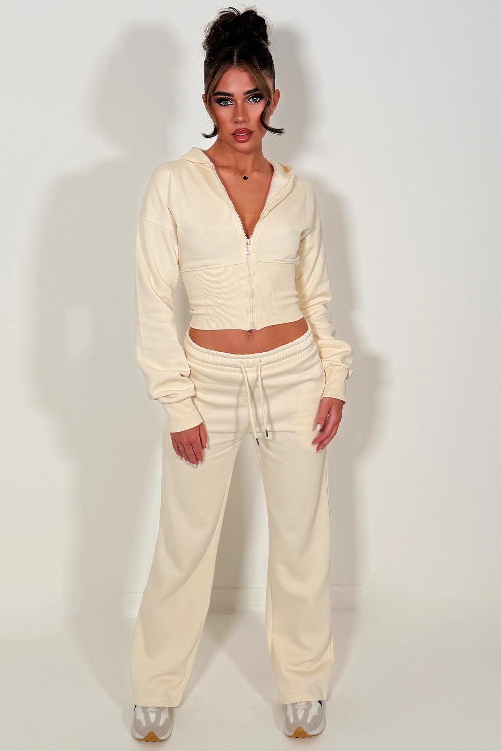 womens crop corset cinched waist hoodie and joggers tracksuit set airport outfit cream styledup