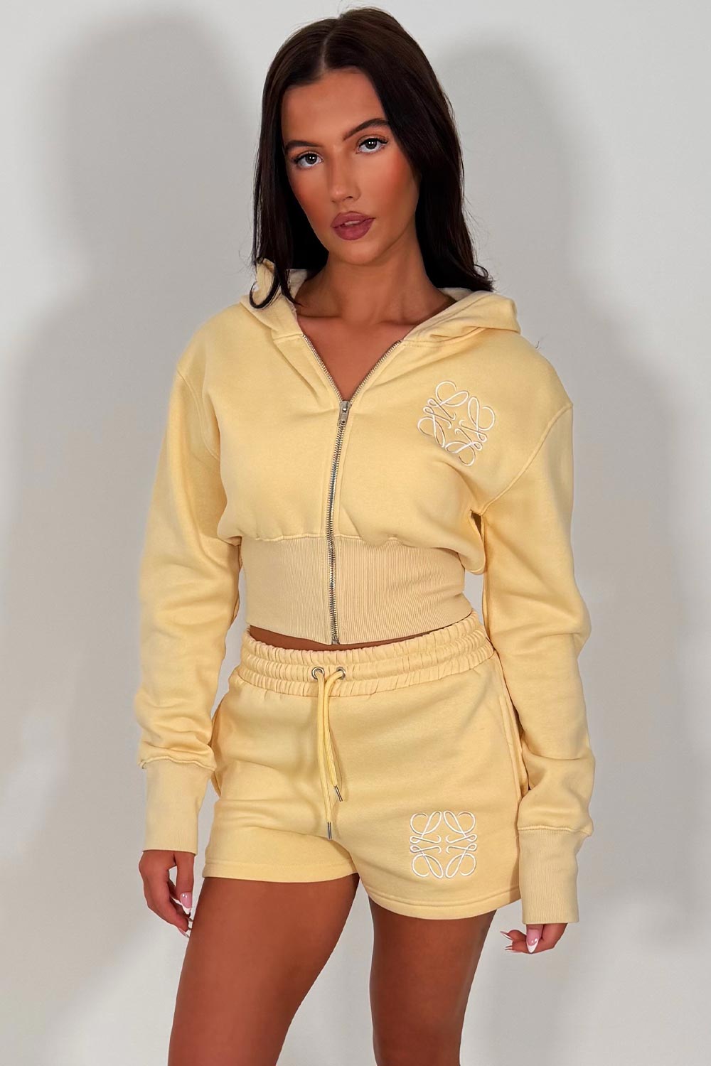 womens cinched waist crop corset hoodie and shorts tracksuit embroidery detail airport outfit co ord