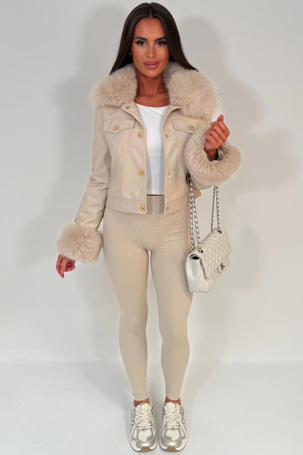 womens beige fur cuff and collar faux leather jacket with gold buttons styled up