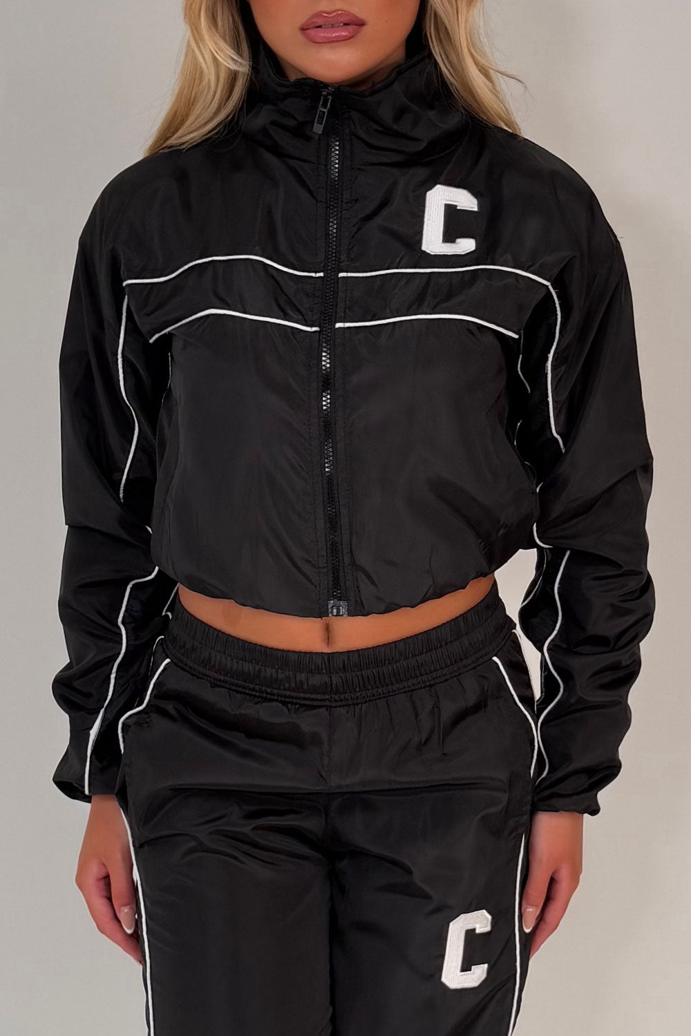 black crop funnel neck jacket and track trousers summer holiday festival outfit styledup uk