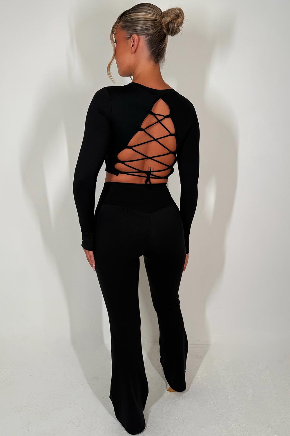 backless sports crop top and scrunch bum flare trousers two piece set matching outfit