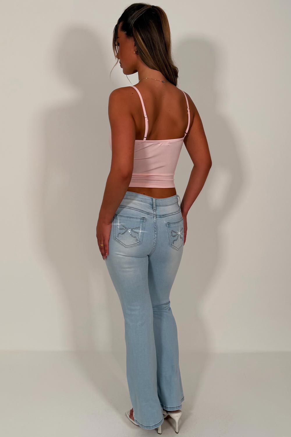 ripped knee flared jeans low rise boot cut diamante rhinestone bow detail