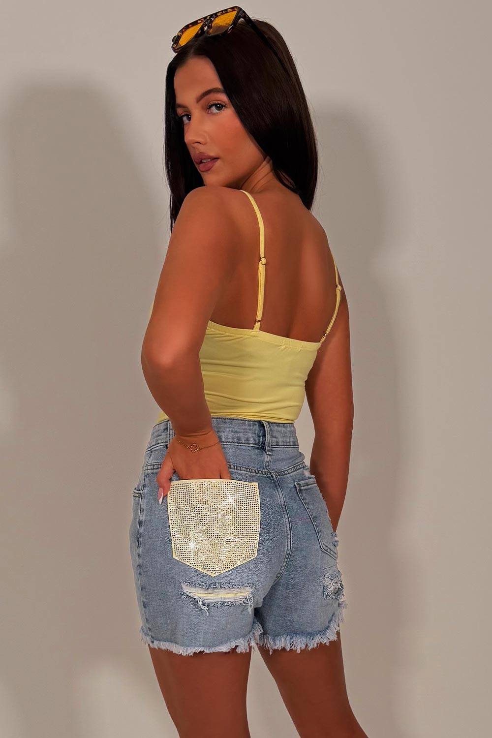 denim blue shorts with contrast yellow pocket diamante rhinestone applique womens