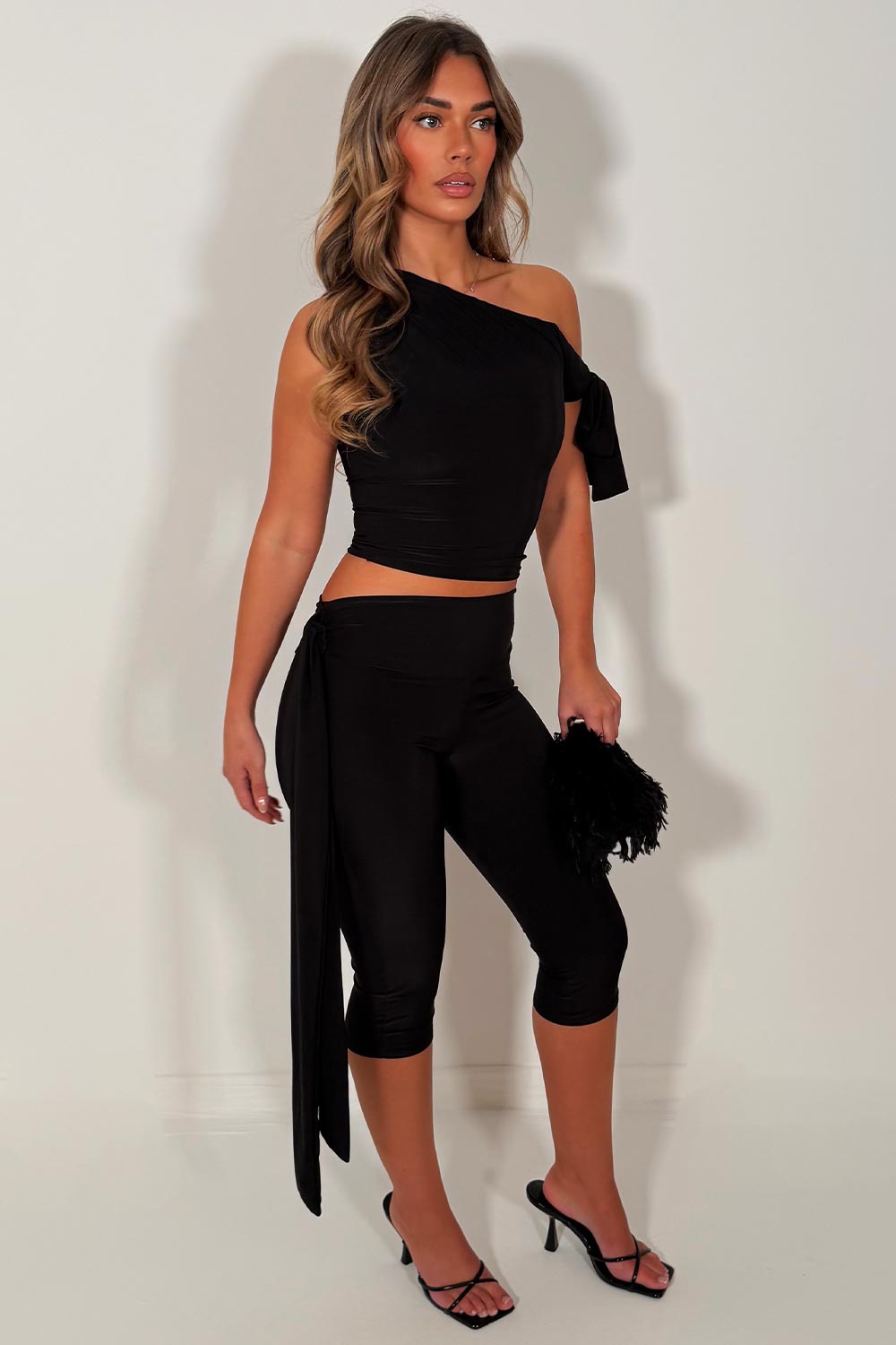 black capri pants with side drape detail and asymmetric neckline crop top two piece co ord set night out occasion outfit for womens