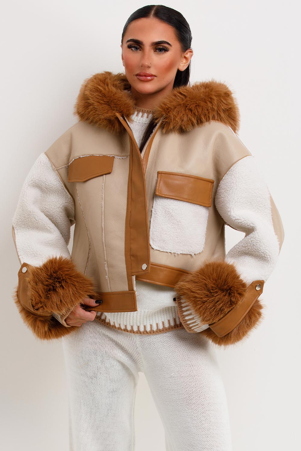 womens faux leather jacket with faux fur hood and shearling detail