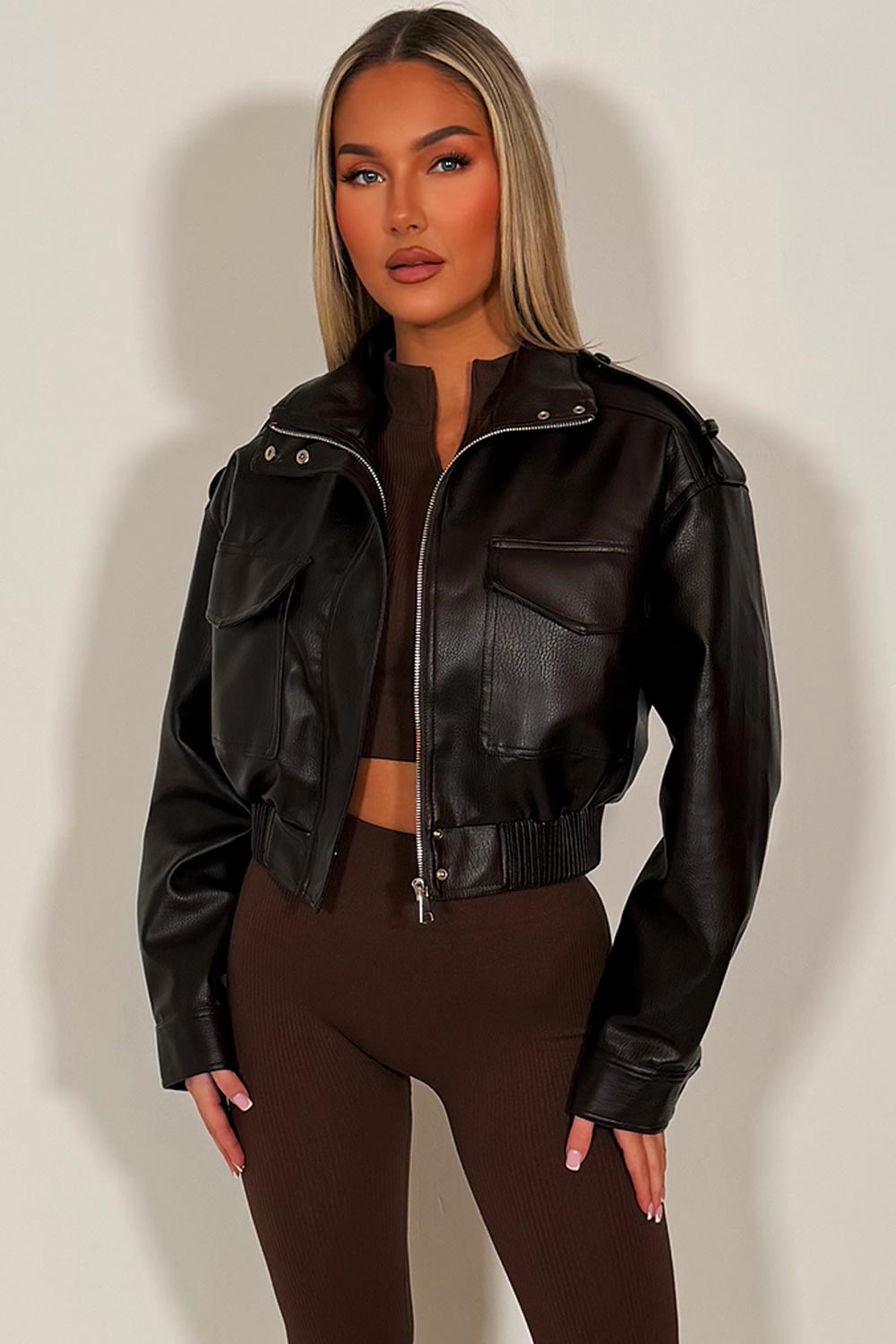 womens faux leather jacket with front pockets elasticated hem and shoulder tabs styledup