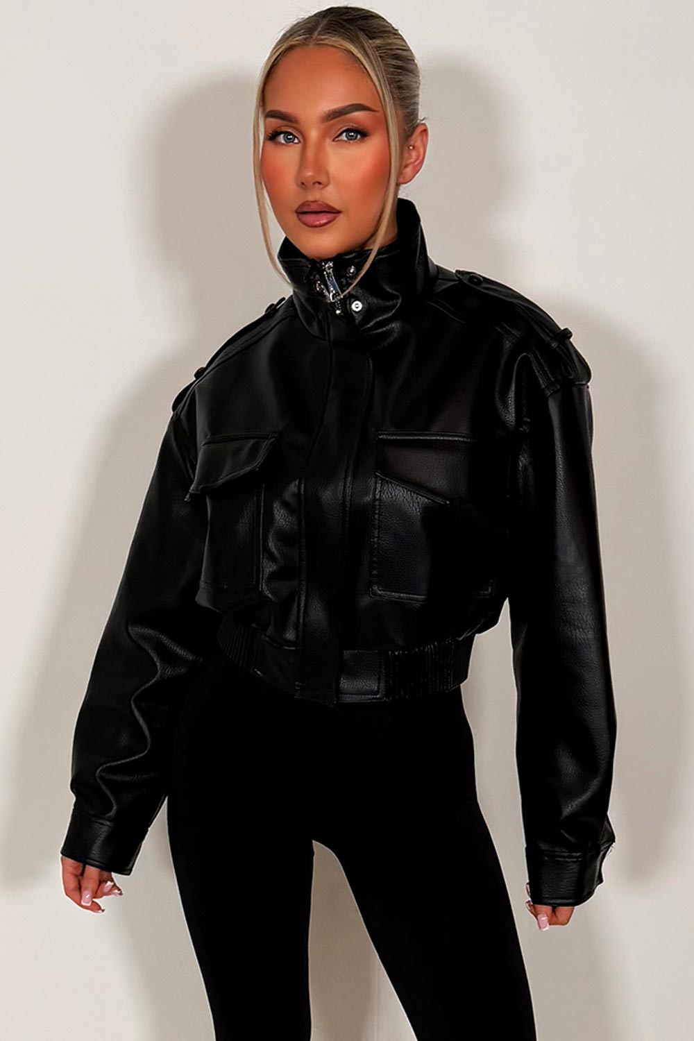 womens zara black faux leather short jacket with high collar long sleeves shoulder tabs pockets on front zip fastening styledup