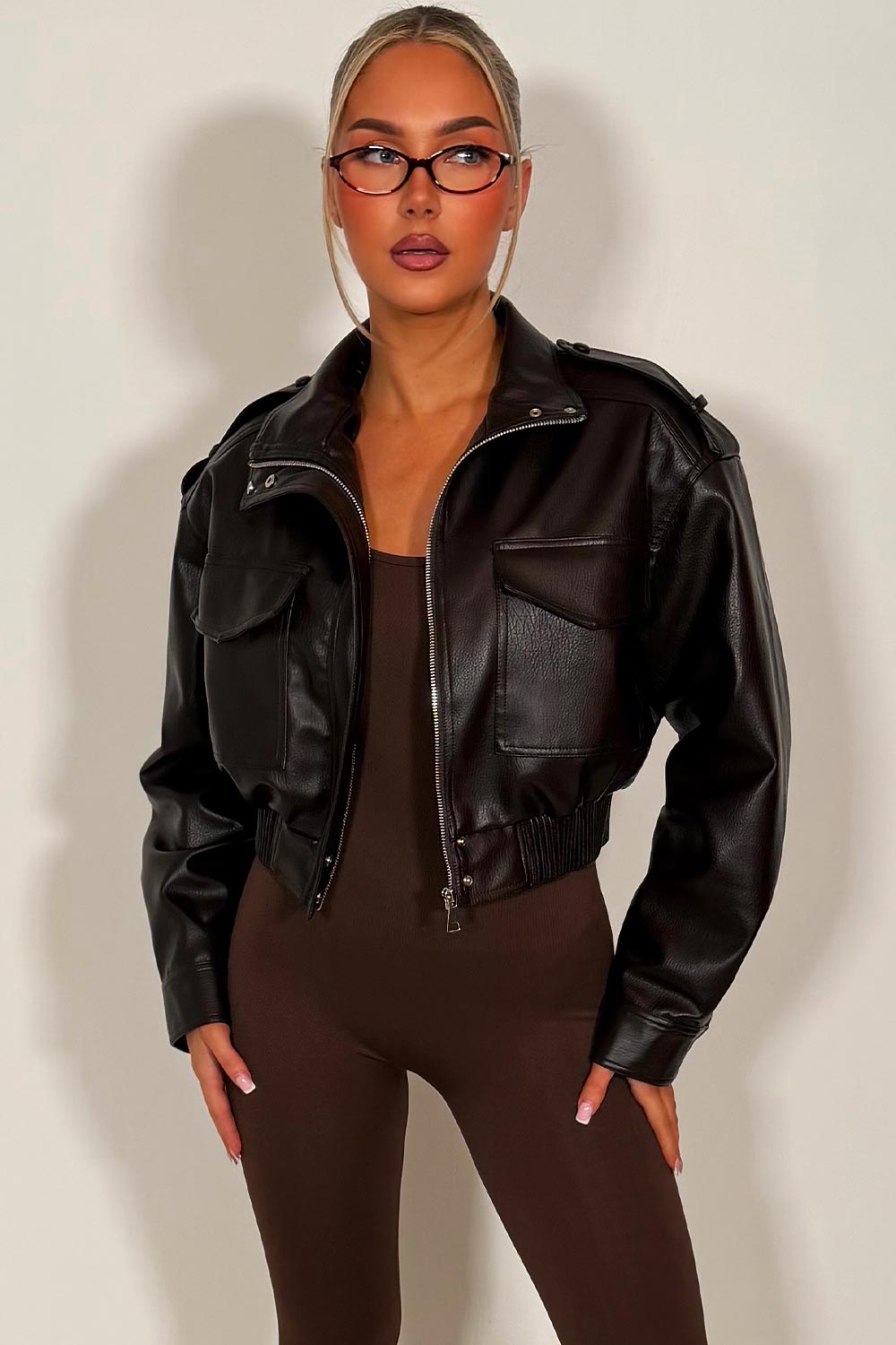 womens zara brown faux leather short jacket with high collar long sleeves shoulder tabs pockets on front zip fastening styledup