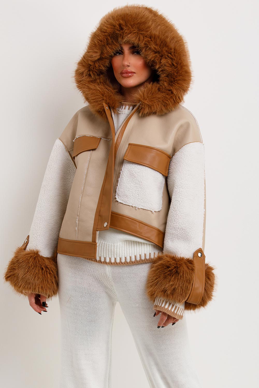 womens faux leather jacket with fur hood and shearling detail