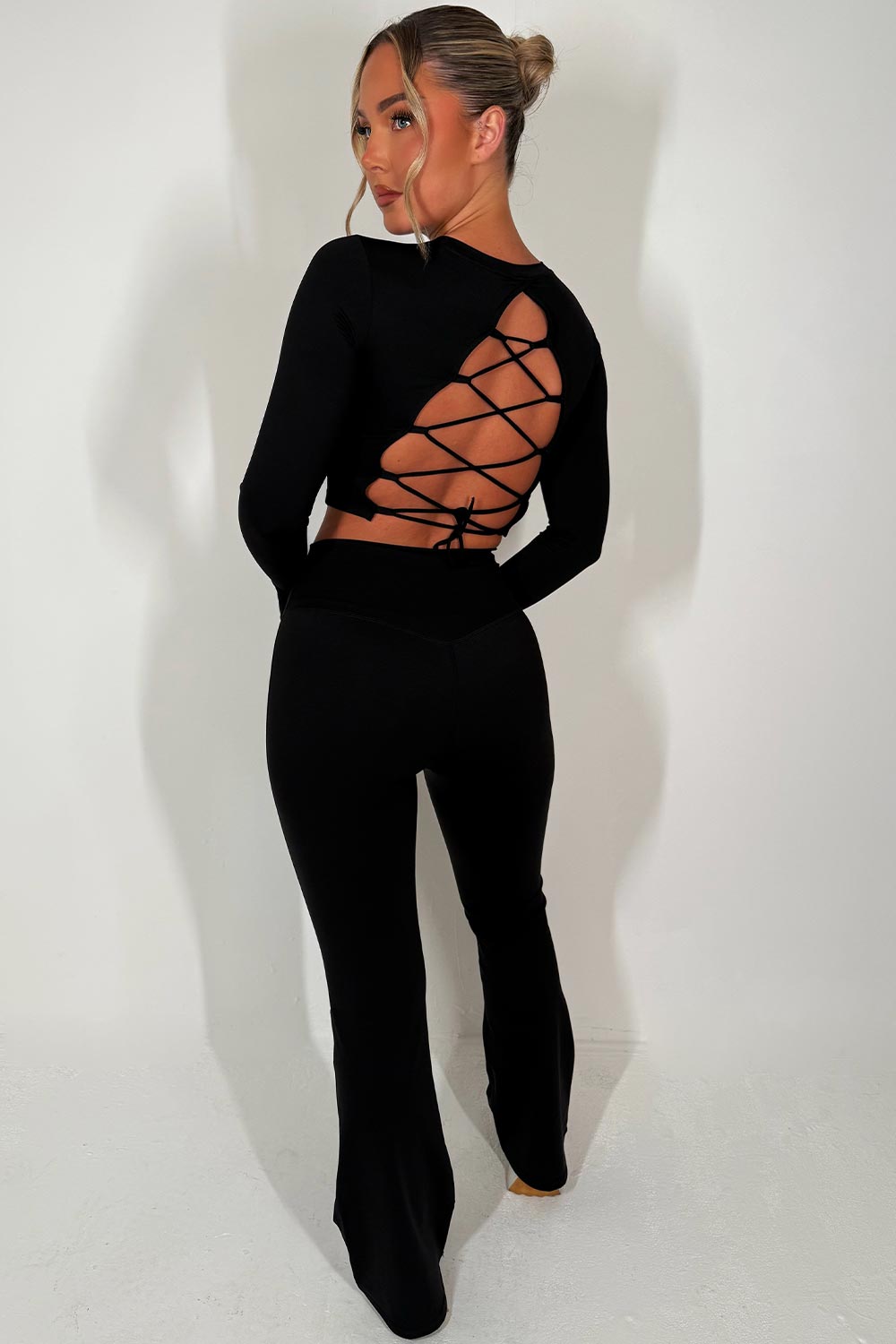 backless sports crop top and scrunch bum flare trousers two piece set skims uk