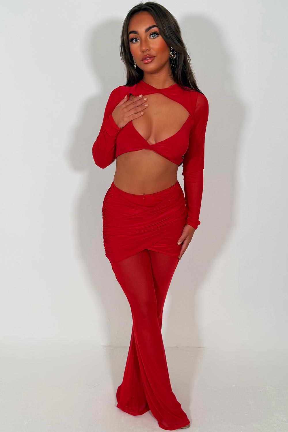 long sleeve cut out crop top and mesh flare trousers two piece co ord set red styledup