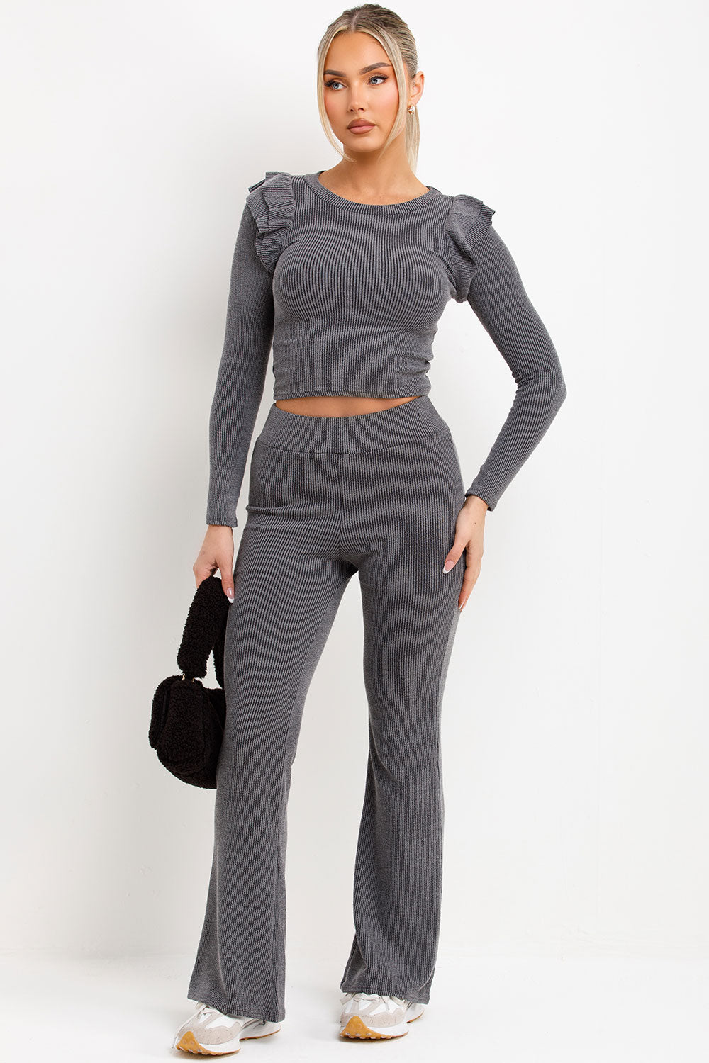 long sleeve rib top with frill ruffle shoulder and high waist skinny flare trousers loungewear co ord set womens streetwear casual outfit