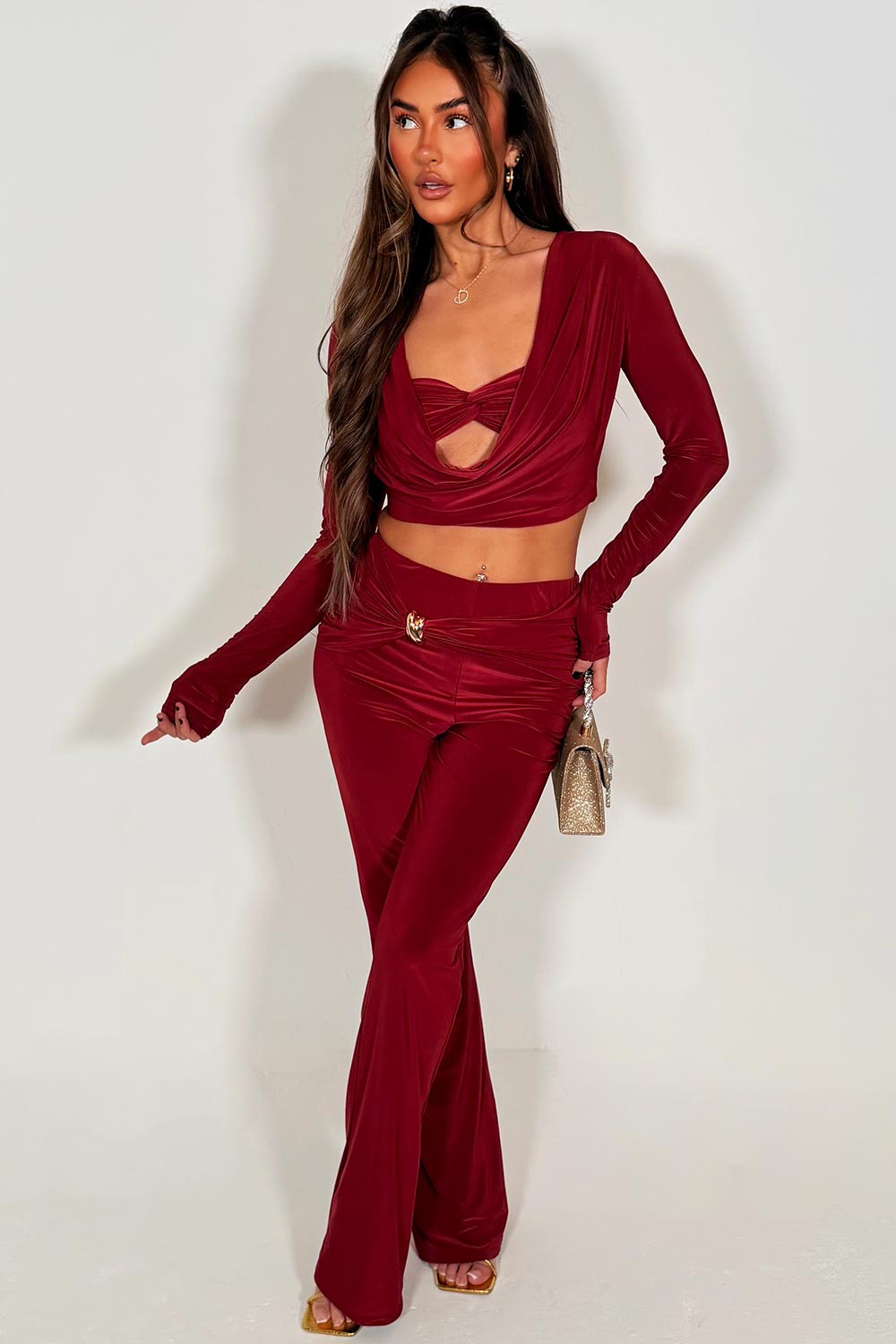 gold buckle twist front skinny flare trsouser and long sleeve crop top co ord set burgundy