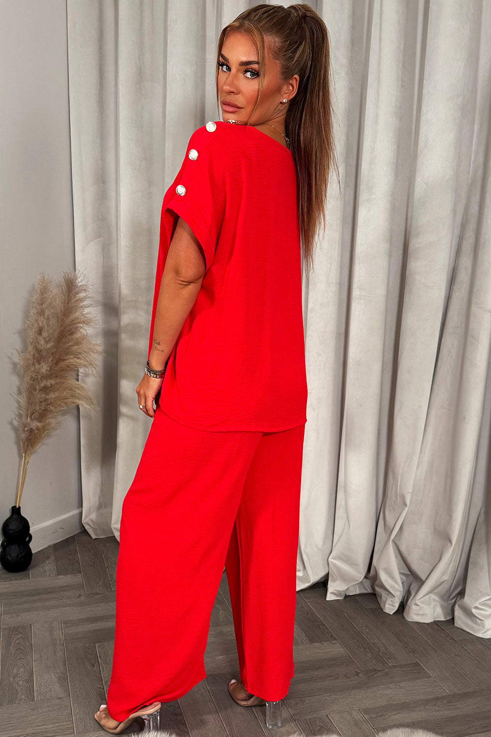 womens oversized top with gold button detail and matching wide leg trousers co ord set christmas party outfit