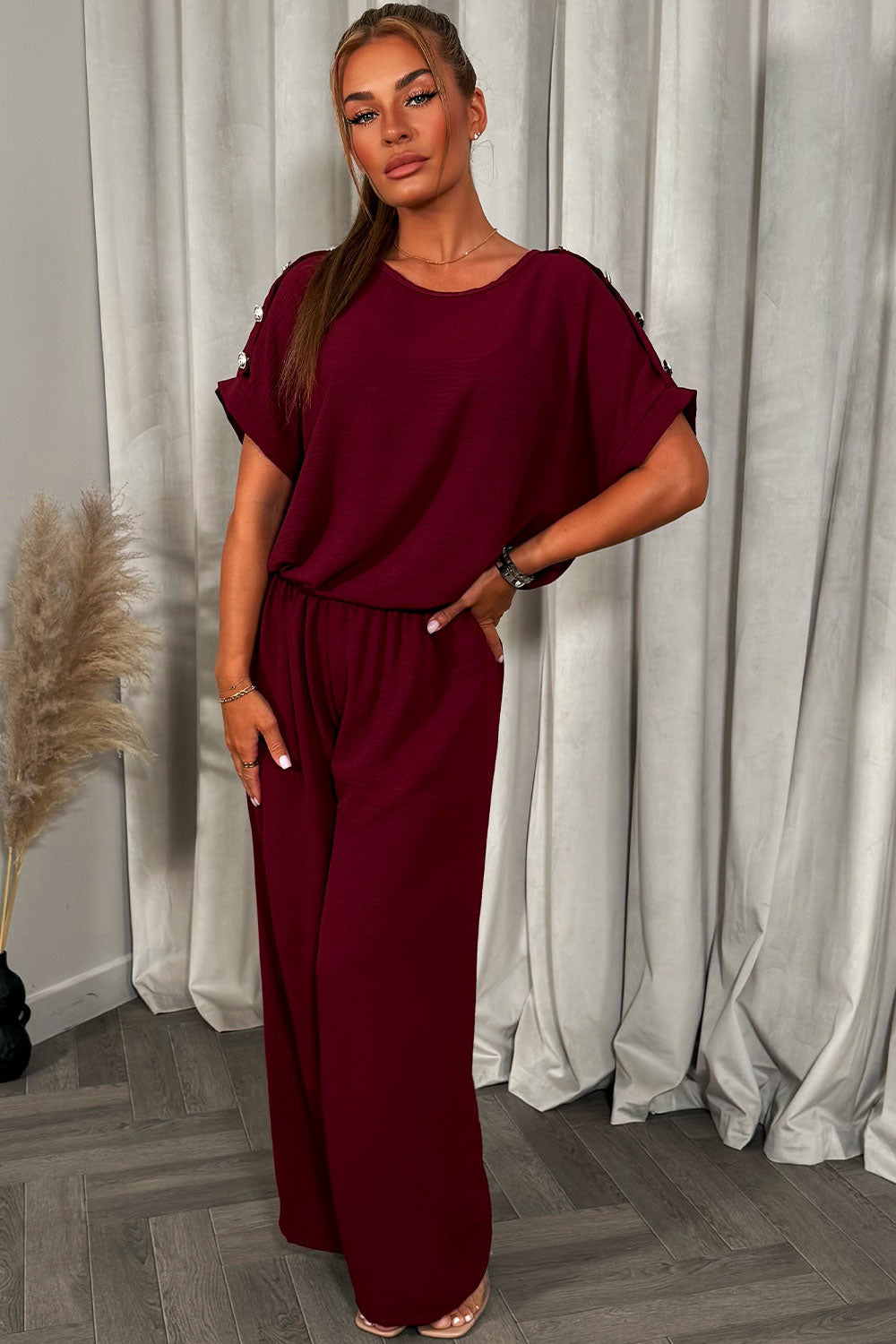 womens christmas party outfit top with gold button shoulder and matching trousers two piece co ord set