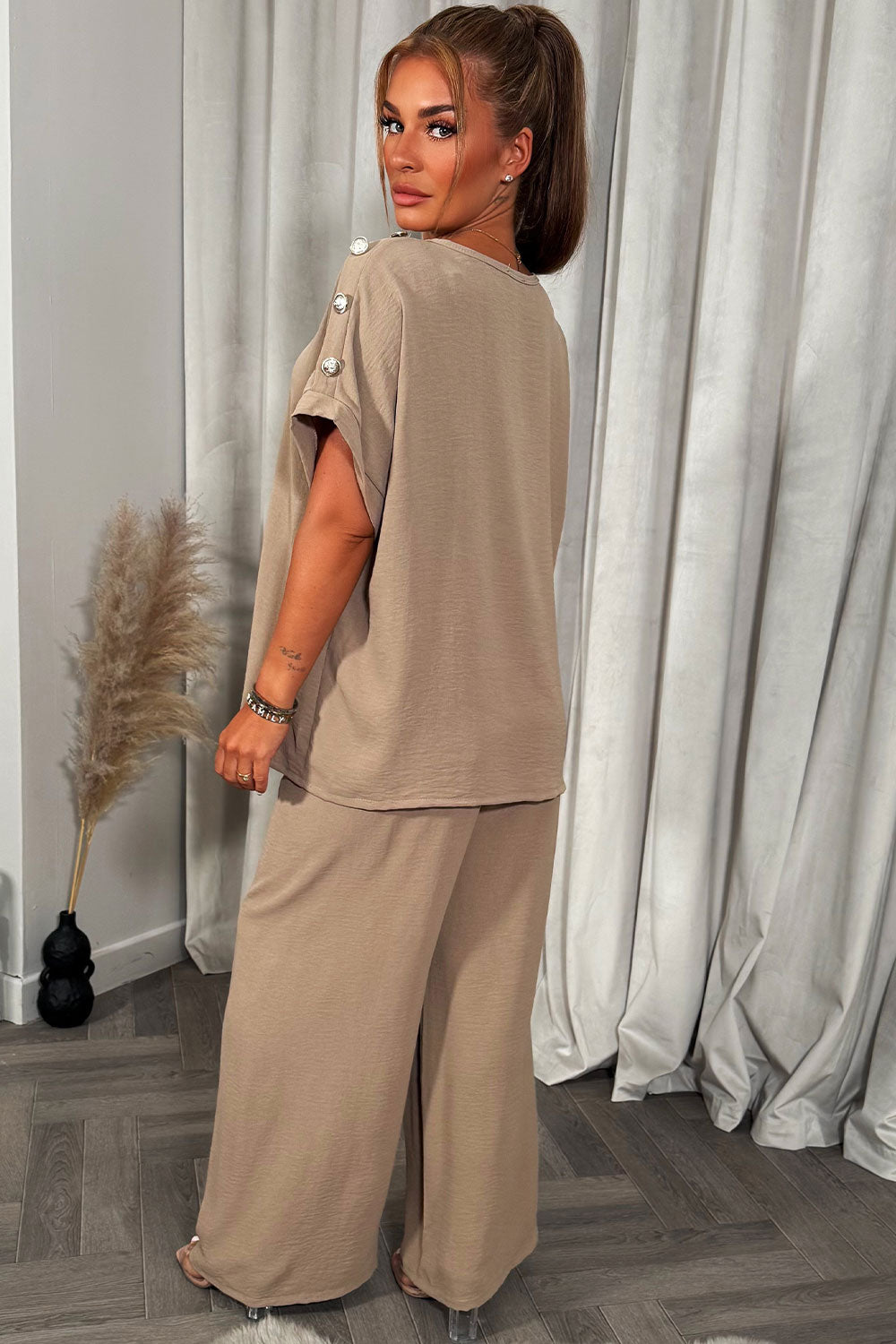 womens oversized top with gold button detail and matching wide leg trousers co ord set christmas party outfit