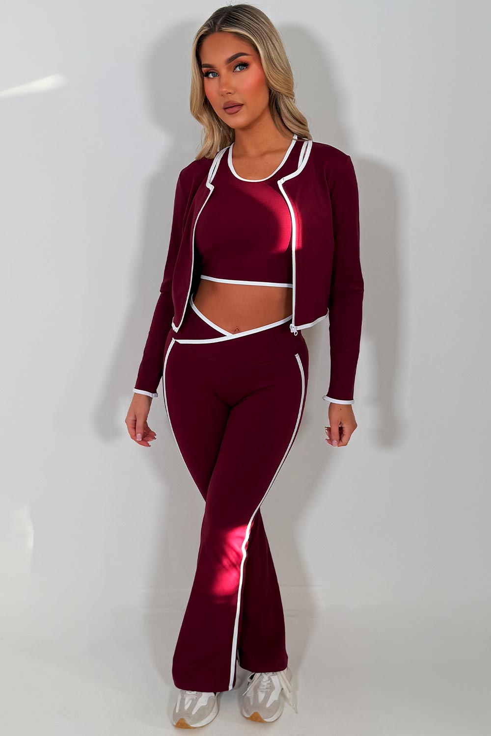 zip up sports jacket crop top and scrunch bum skinny flare pants 3 piece set burgundy