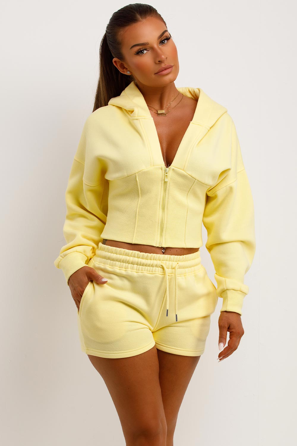 crop hoodie with cinched waist and shorts tracksuit two piece co ord set airport outfit