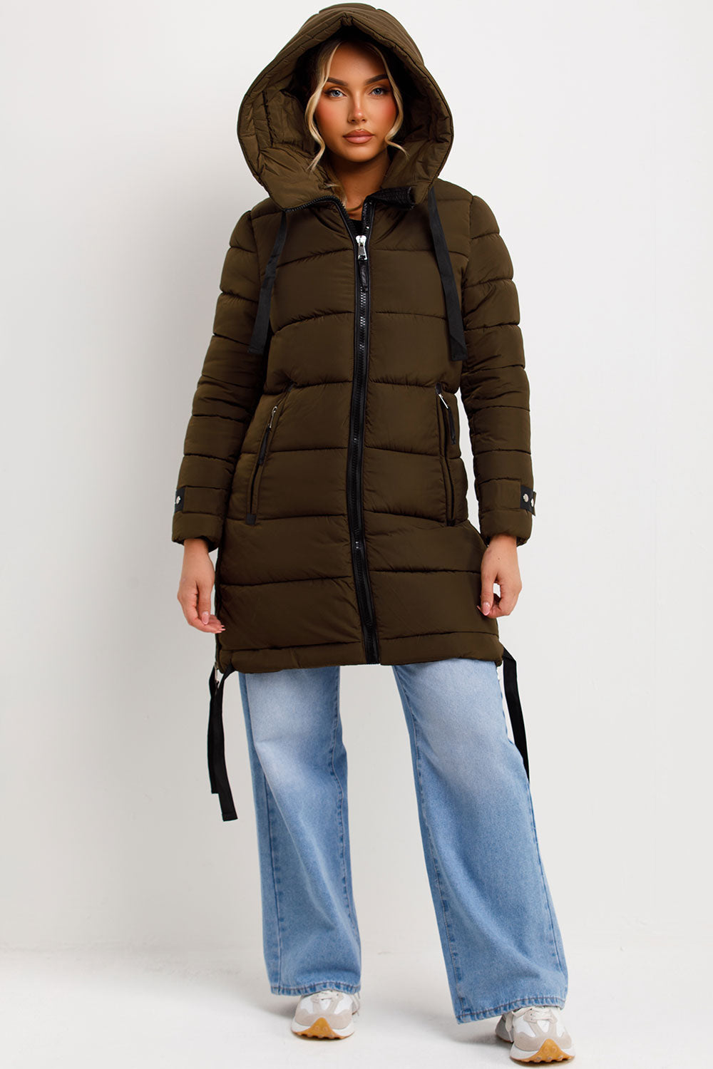 womens long puffer coat with zip pockets for winter styledup