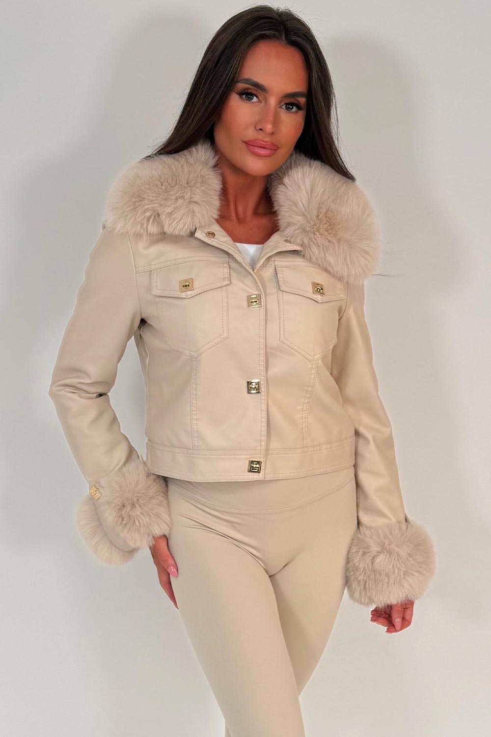 womens fur cuff and collar beige faux leather jacket with gold buttons styled up for christmas party night out outfit