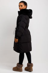 Long Black Puffer Coat With Faux Fur Hood And Drawstring Waist