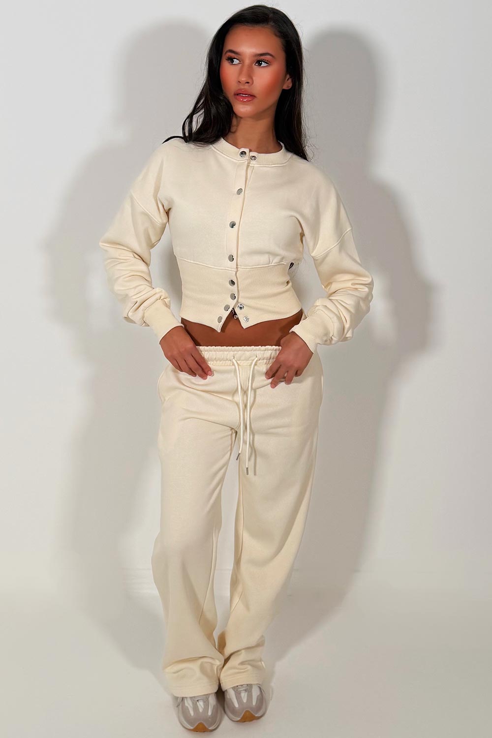 womens button up compress waist crop tracksuit styledup airport outfit travelling clothes cream styledup