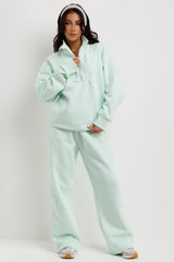 mint green half zip jumper and joggers tracksuit lounge set airport outfit