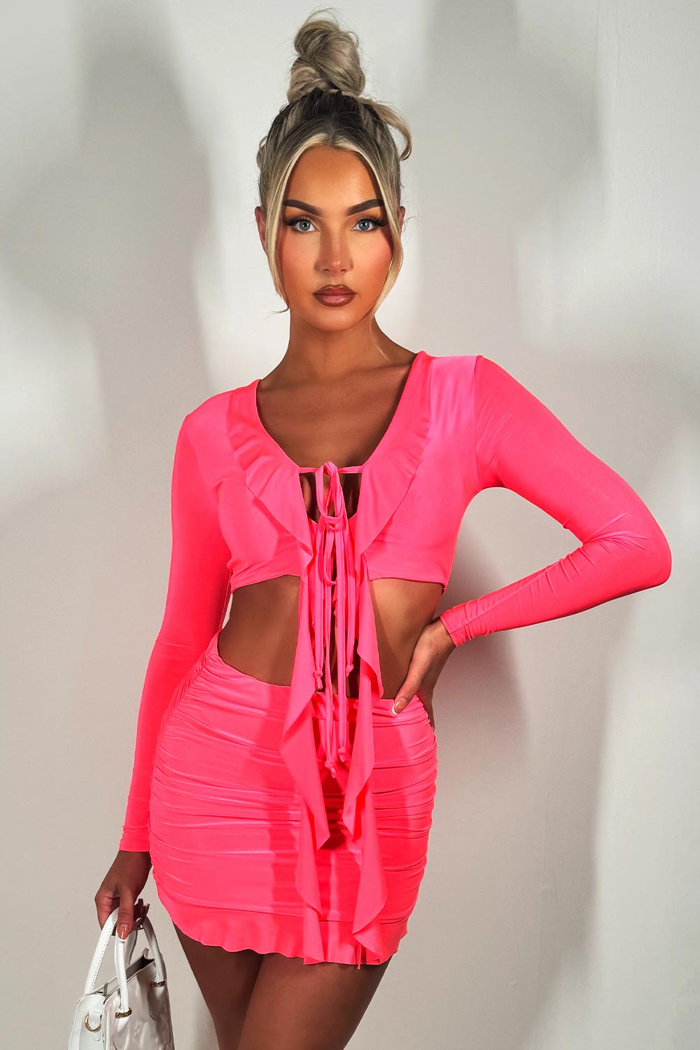 neon pink frilly tie front long sleeve crop top and skirt co ord set festival going out holiday outfit