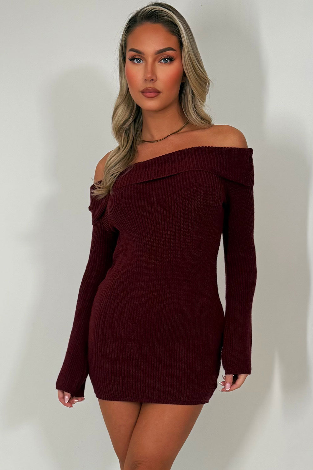 knitted jumper dress with long sleeves and off shoulder neckline styledup christmas party outfit