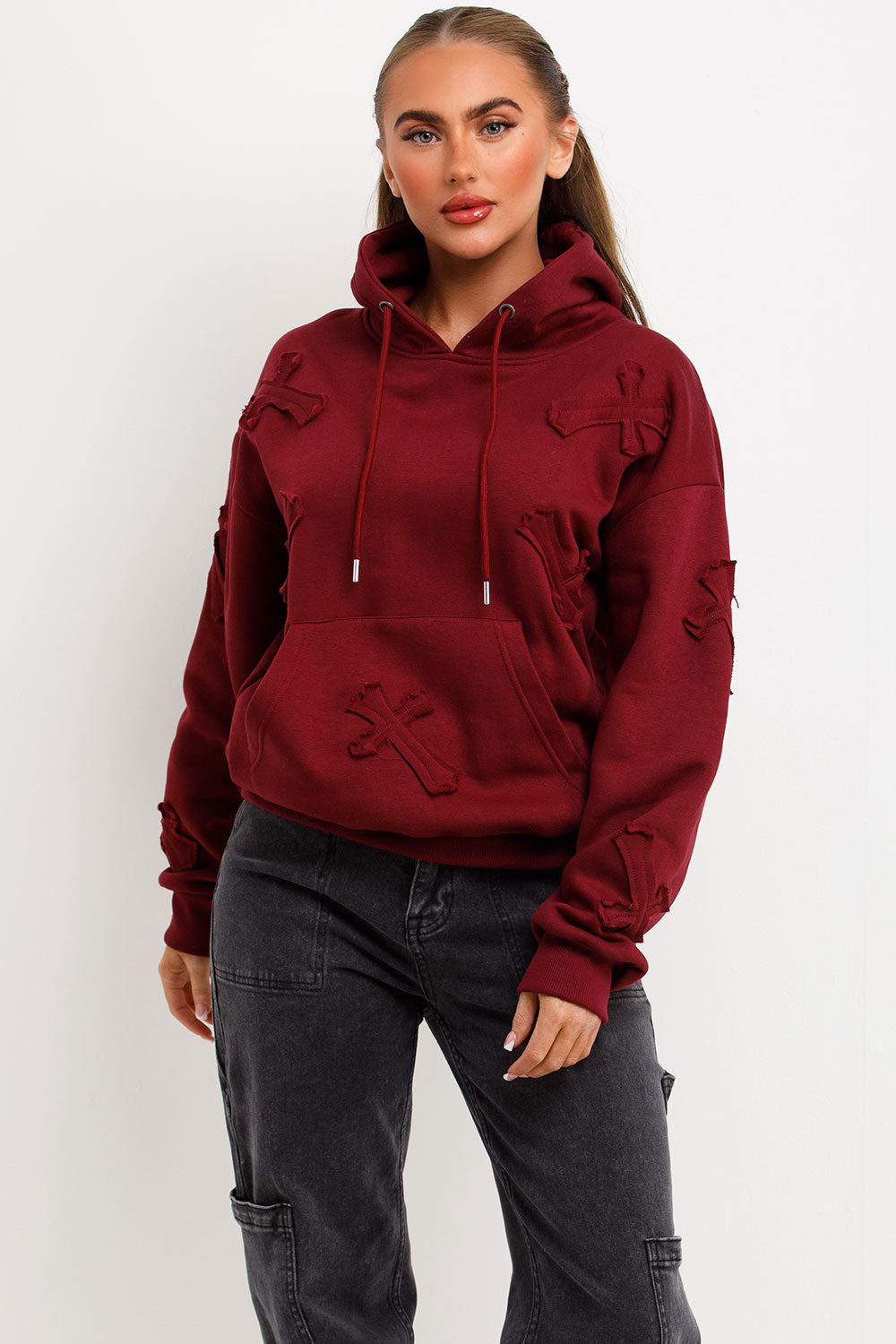 womens oversized hooded sweatshirt with cross applique