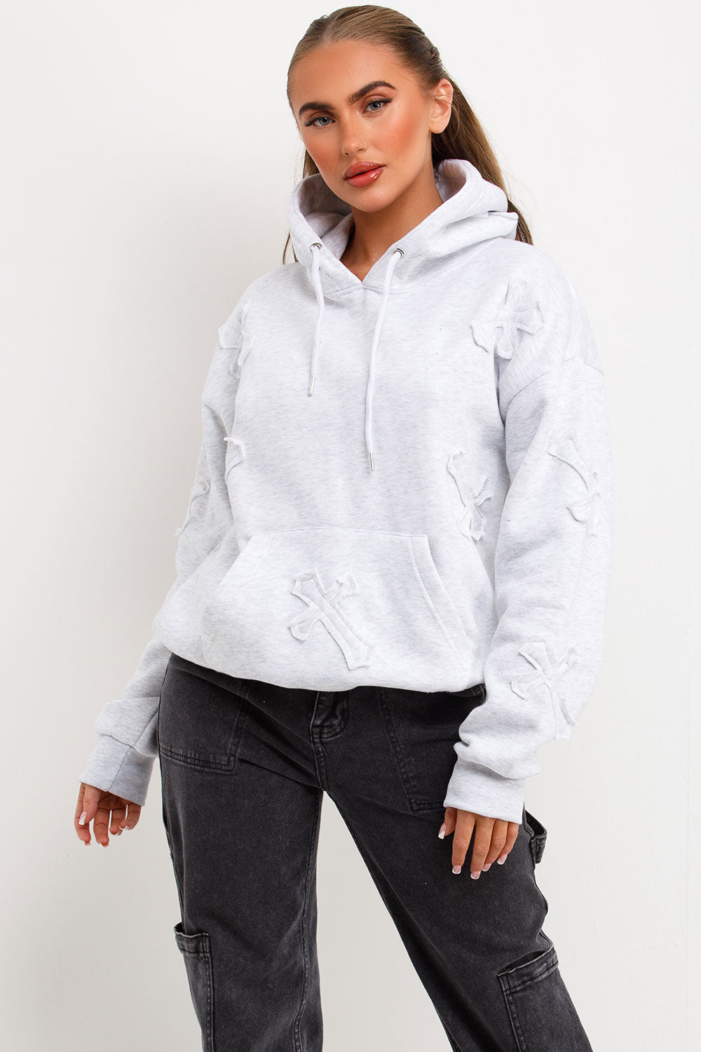womens oversized hooded sweatshirt with cross applique