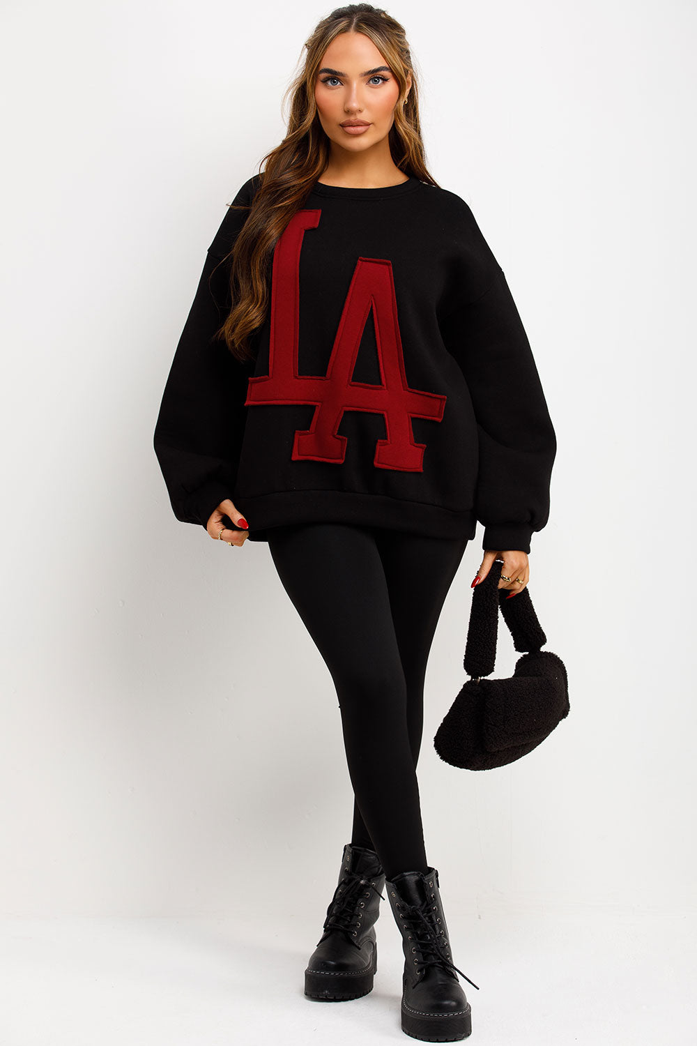 womens long sleeve round neck black jumper with la slogan