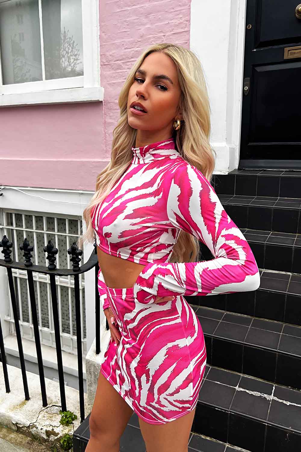 mini skirt and long sleeve crop top neon pink festival outfit