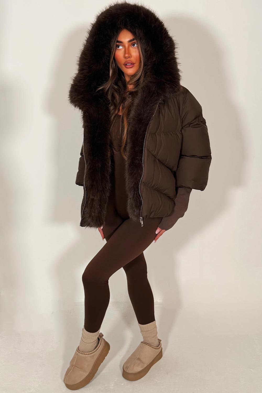 faux fur hood puffer jacket with faux fur trim on the front brown styledup womens outerwear
