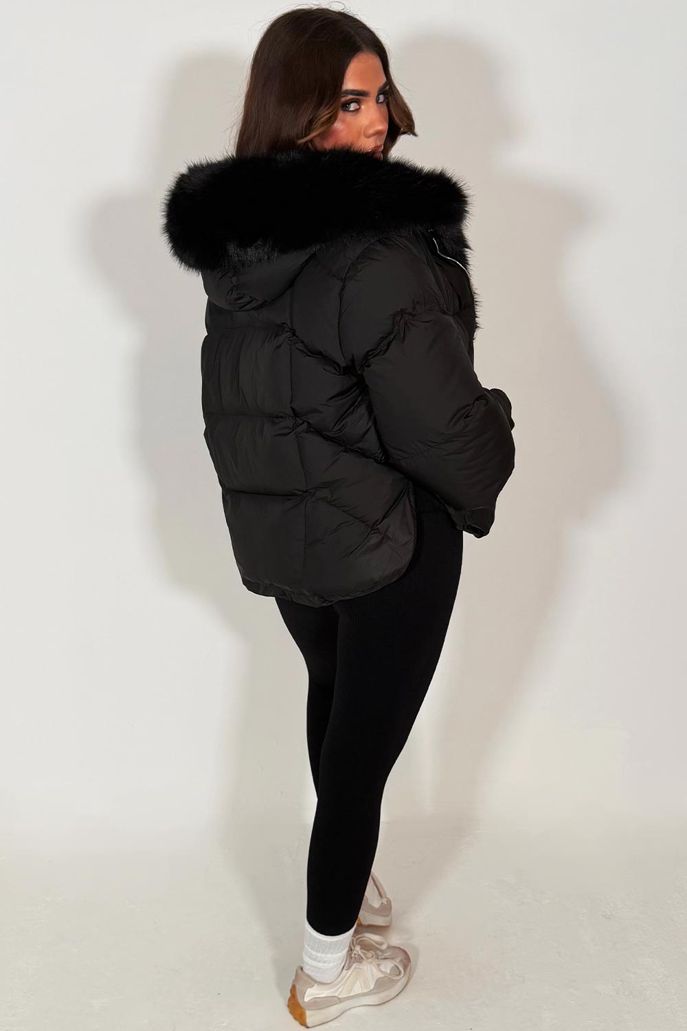 womens black fur hood puffer jacket with fur trim on the front styledup