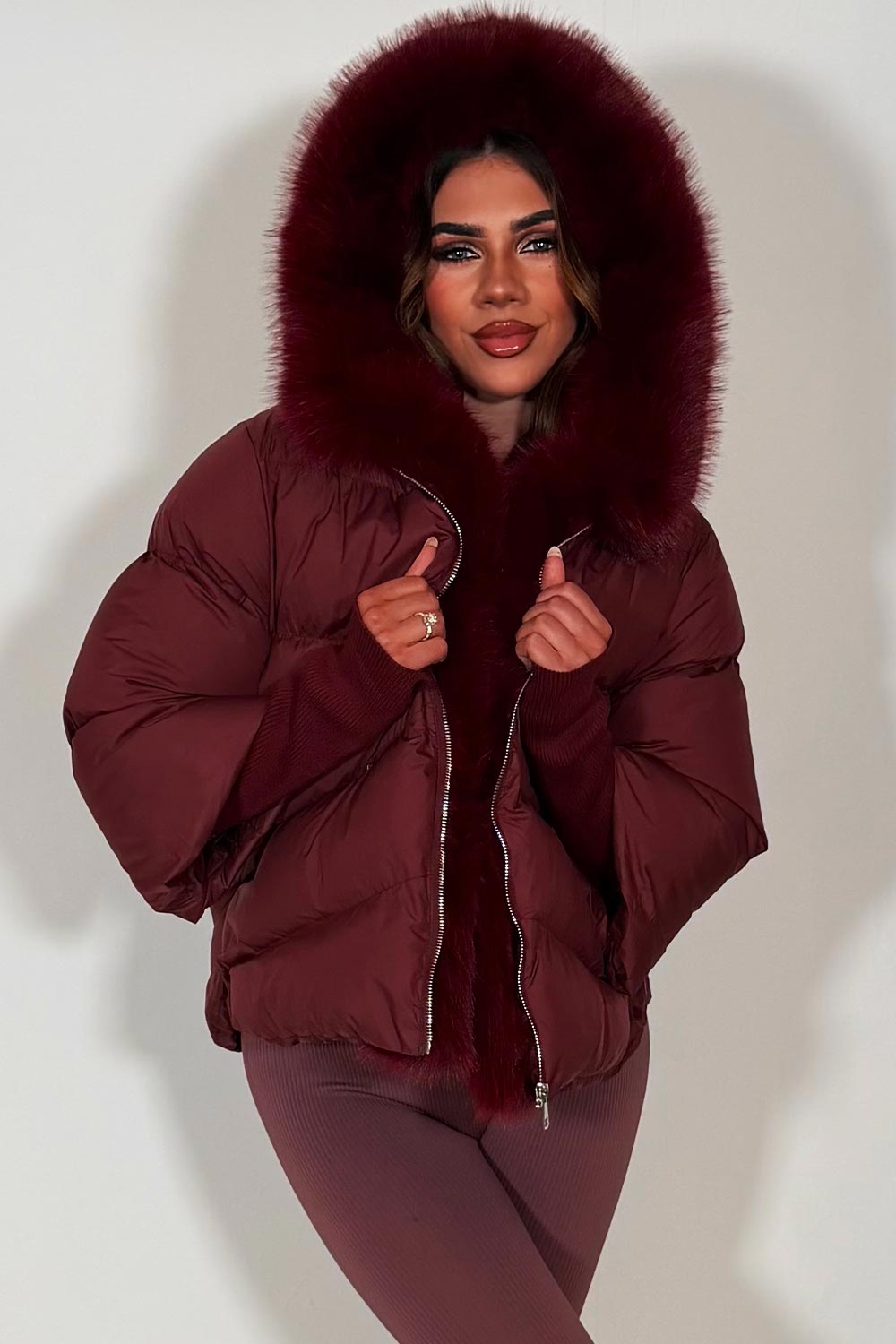 womens burgundy fur hood puffer jacket with fur trim on the front styledup